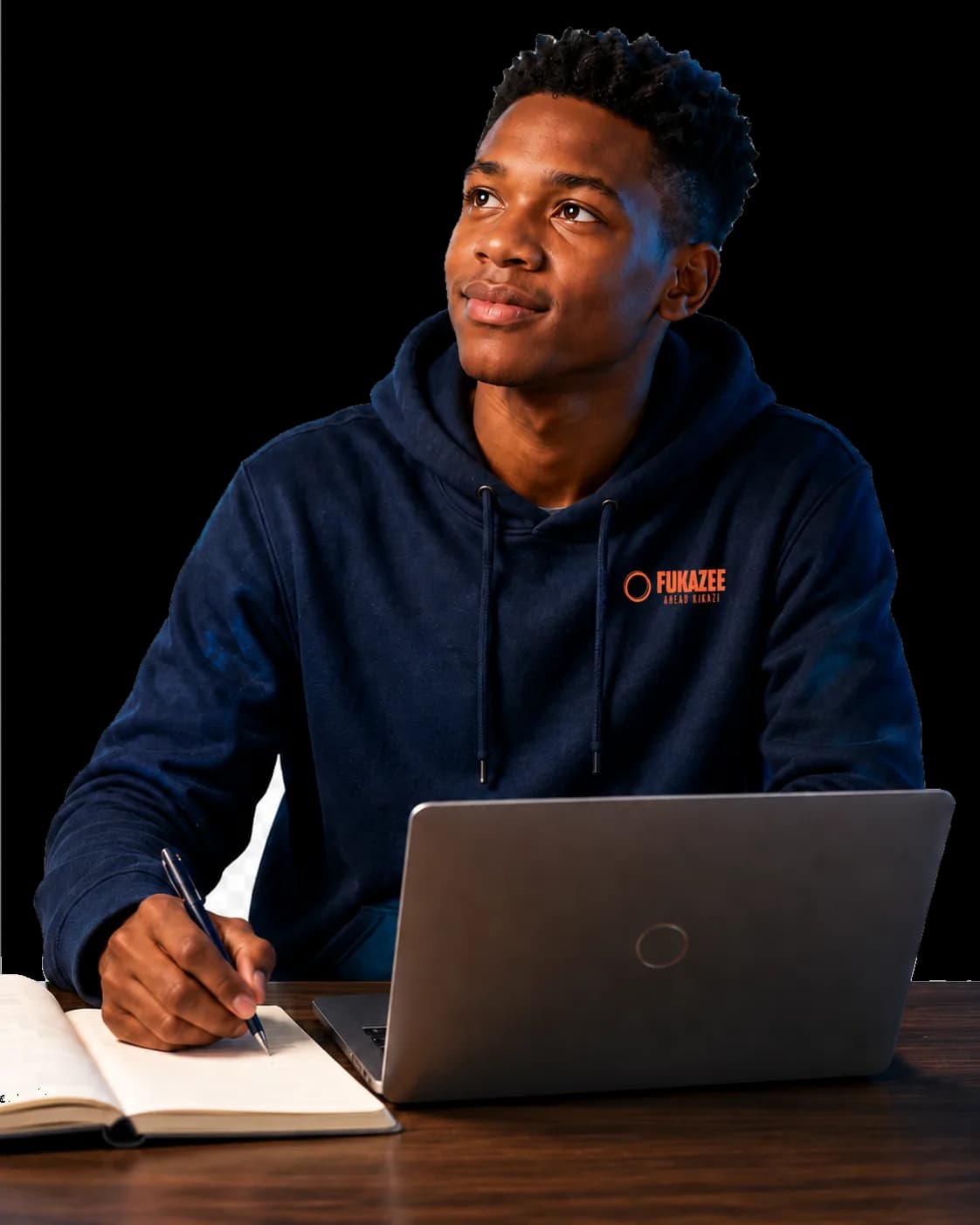 Young FuKazee student in a FuKazee hoodie learning with a laptop and notebook