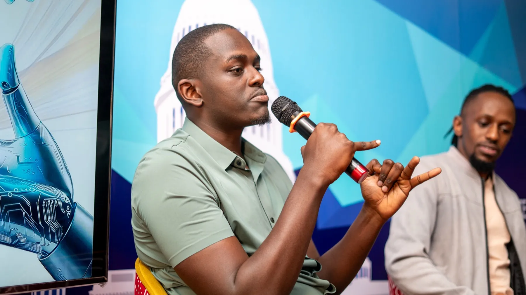 Rodney Maina speaking about AI on a panel