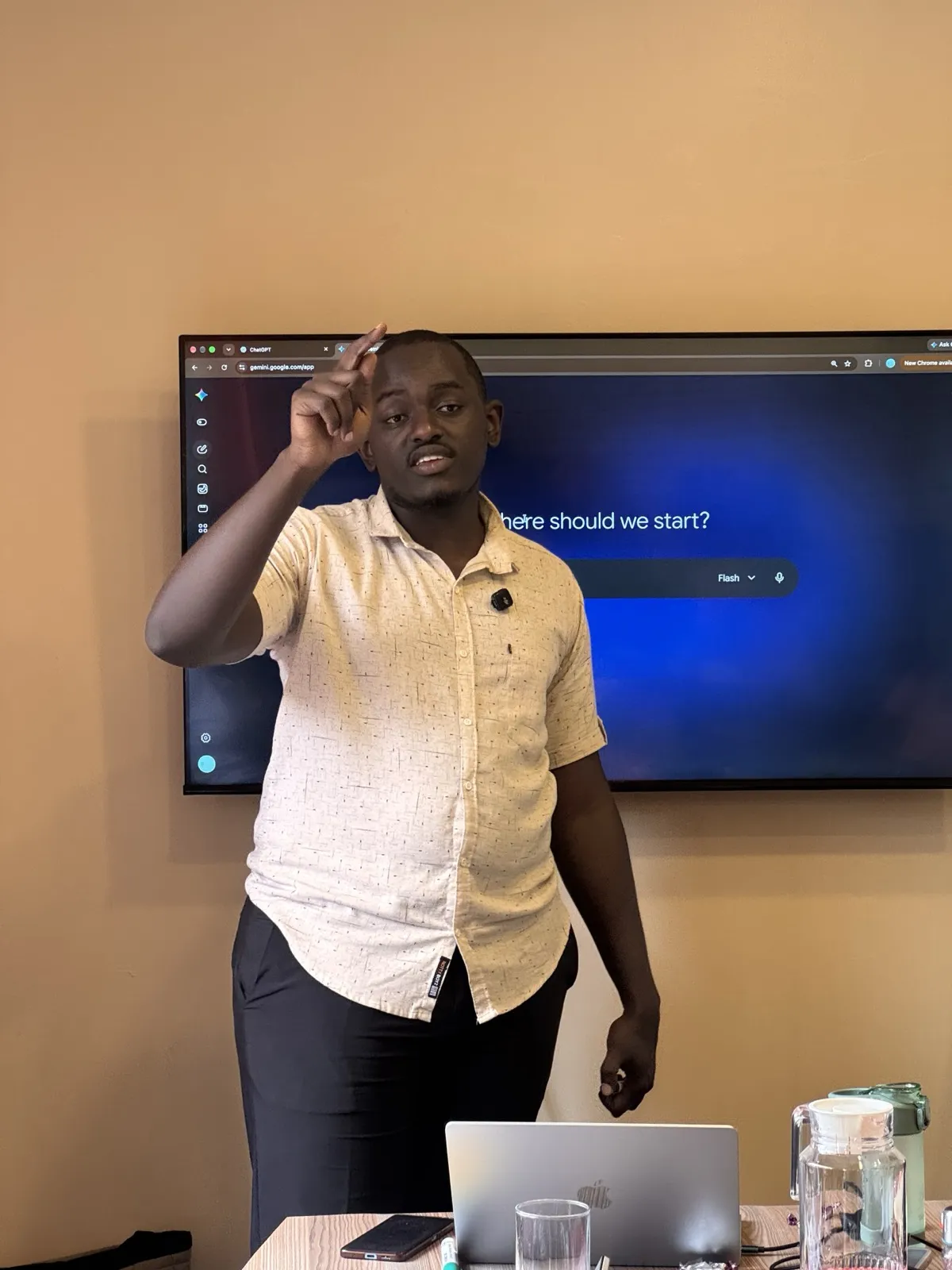 Rodney Maina teaching a corporate team, pointing at a live AI tool on screen